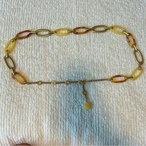 Chain belt with tortoise shell gold cream links